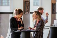 AC23 Two women standing talking.jpg