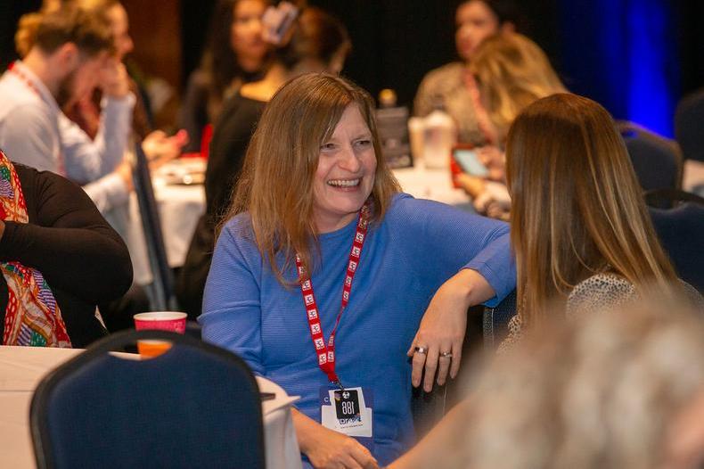 AC23 woman blue top smiling.jpg