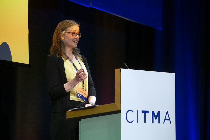 Speaker with citma lectern.jpg