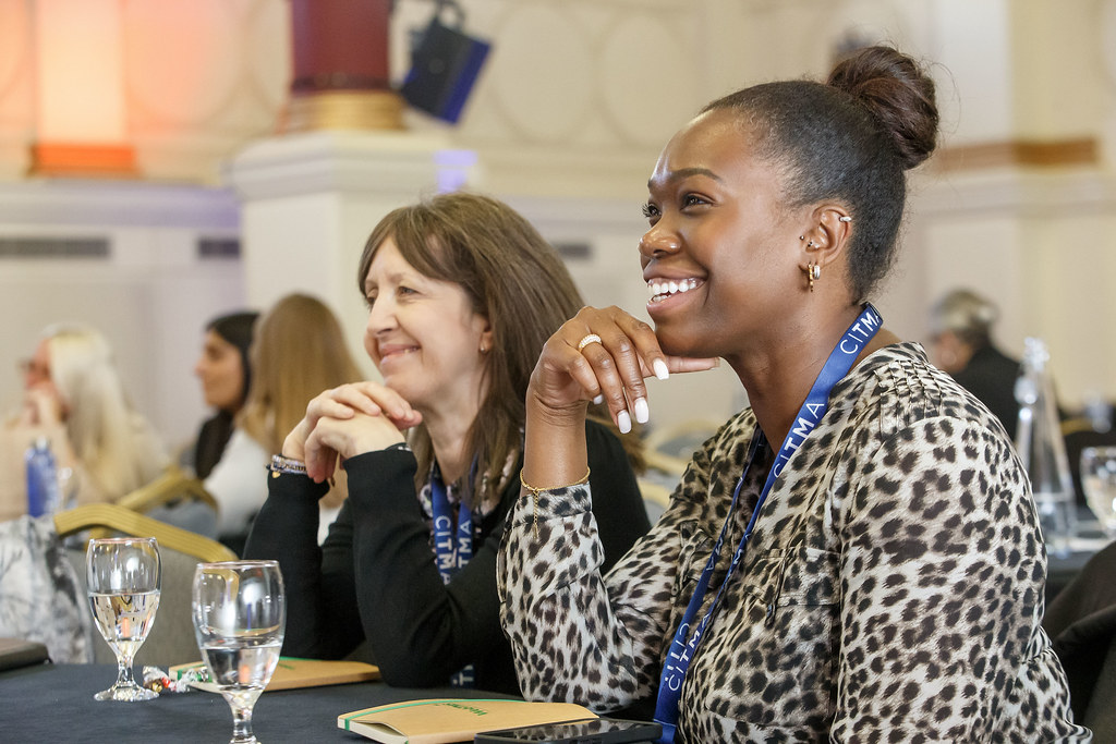 Paralegal Conference 2024 - Women smiling at table.jpg