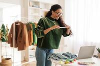 Woman taking photo of clothes.jpg