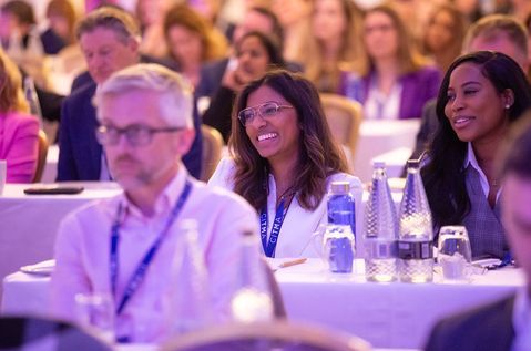 Spring Conf 24 - Two delegates smiling in crowd.jpg