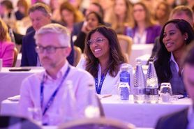 Spring Conf 24 - Two delegates smiling in crowd.jpg